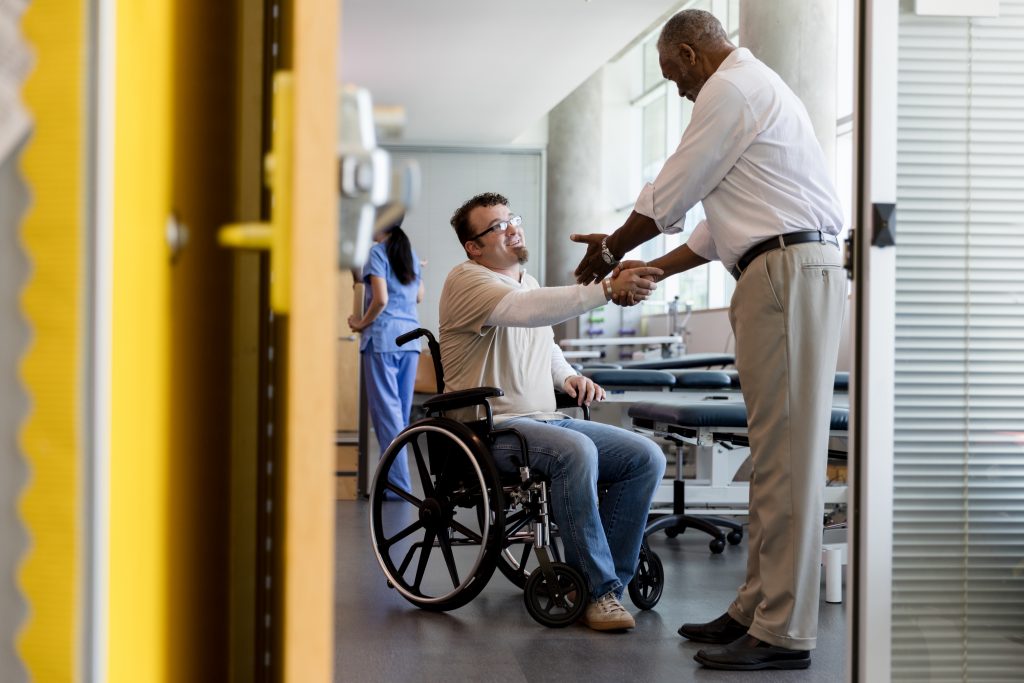 An occupational therapist helping a client