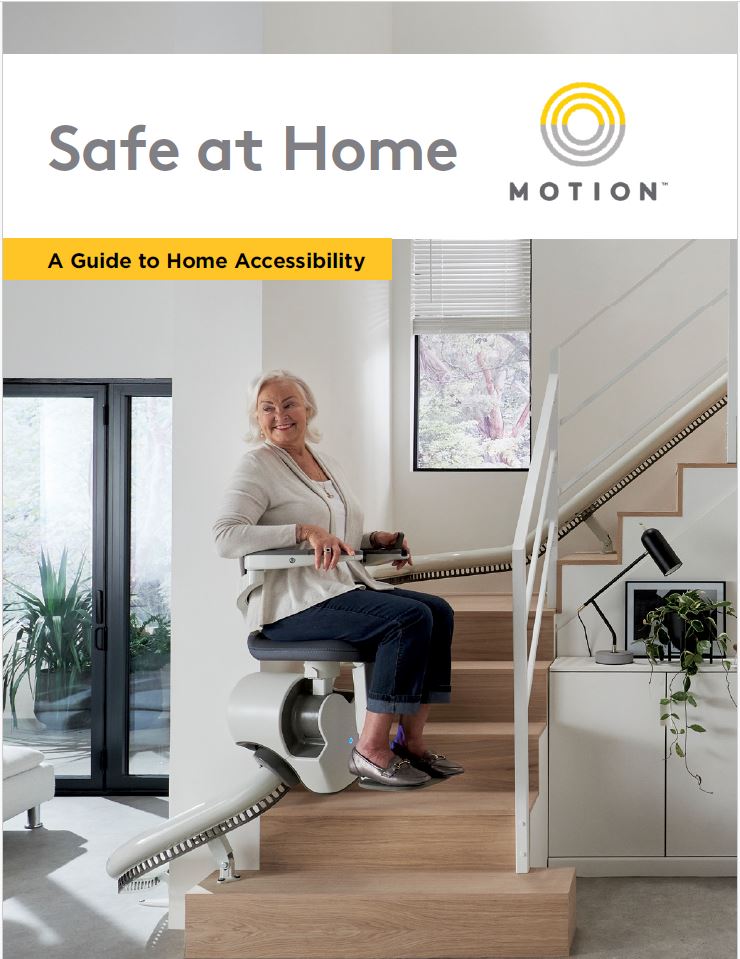 Cover image of Motion's Safe at Home Guide, including a woman seated on the seat of a custom curved stairlift in a contemporary home setting. The text includes Safe at Home, a guide to home accessibility, along with a Motion logo. 