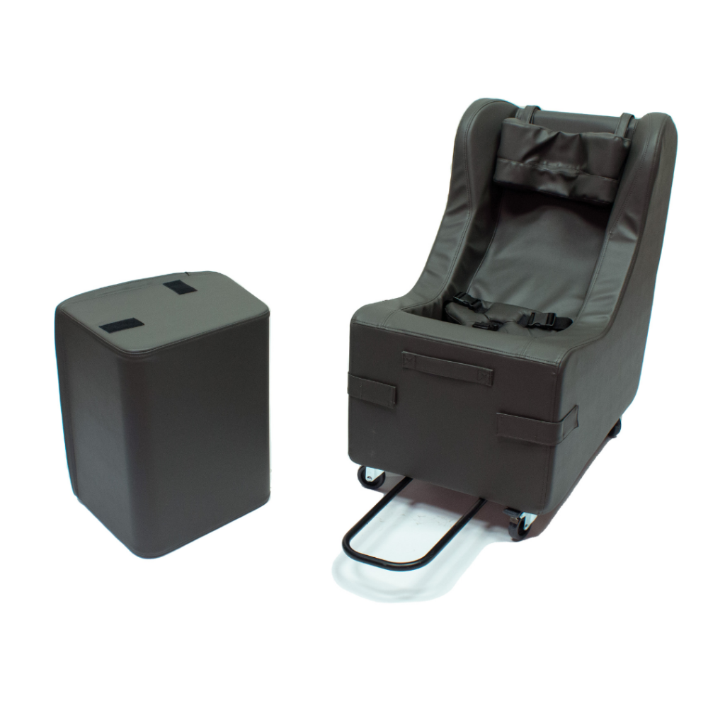 Freedom Concepts Roll'er Chair in black with ottoman in black to the left of chair