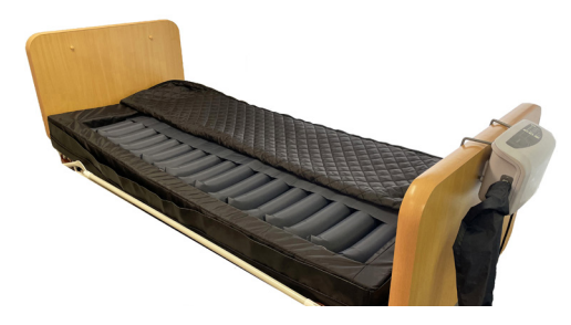 Domus Edge Alternating Pressure Therapy System on a hospital bed. 